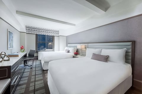 Unwind in a bright double-queen room with city views.