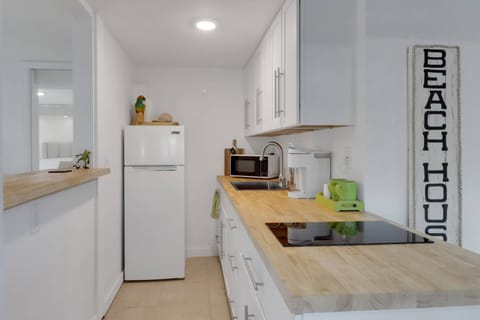 Prepare quick vacation meals in the kitchen, complete with cooktop, fridge/freezer and convenient microwave.