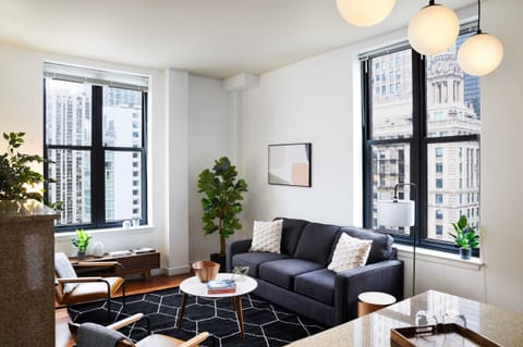 Spacious living room and kitchen filled with light throughout the day