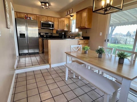 Kitchen with refrigerator, stove/oven, dishwasher and microwave