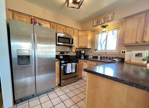 Kitchen has gas stove/oven, microwave and is fully stocked