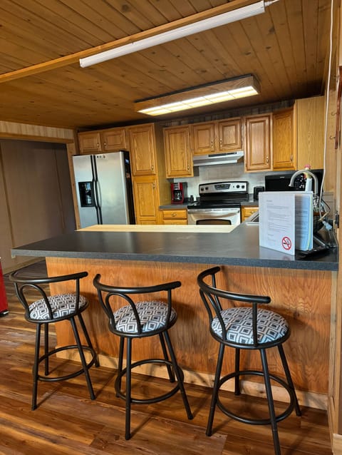 Kitchen stocked with basic dishes, silverware, pots, pans, coffee pot, etc.