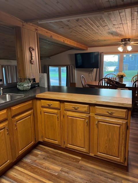Kitchen opens to dining room with large table.  Seat 6 at table + 3 at bar.