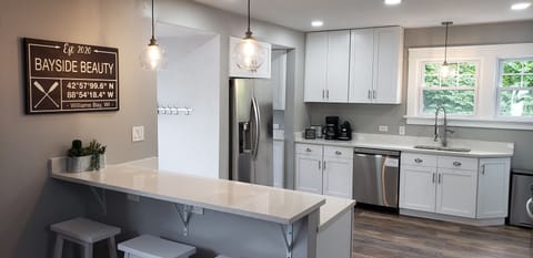 New kitchen with 3 seats at the peninsula.