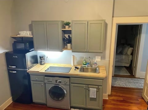 Kitchenette. Apartment fridge, two burners. Washer/dryer combo