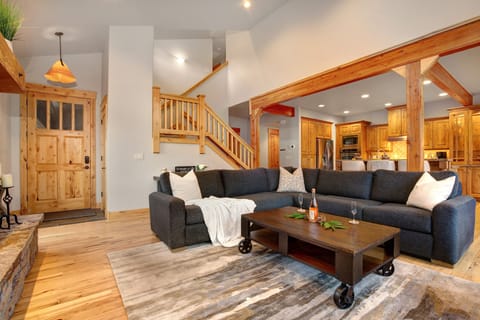 Enter Main Level Great Room with High Ceiling and Hardwood Floors