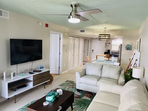 Living room. Brand new leather couches w/ a queen sleeper sofa & foam mattress 