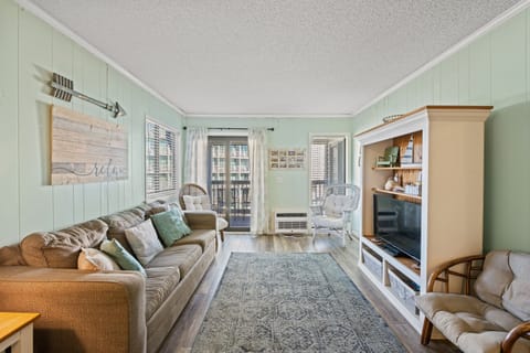 The living room is well-appointed with comfortable furnishings.