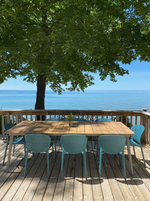 Large lakeside deck ready for outdoor meals. 
