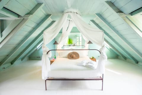 Mainhouse Turquoise Room. This seafoam green loft sits above the mainhouse.