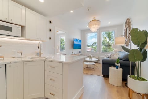 Large, fully stocked kitchenette. Microwave, 2 seater bar counter. Mini fridge, Keurig coffee maker, glasses, plates, and cutlery.

