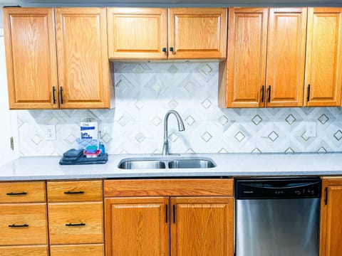 Our kitchen holds all the essential cookware, full-sized stove/oven, microwave, and dishwasher.