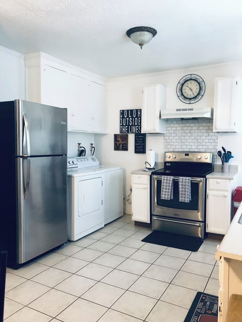 Kitchen with washer and dryer