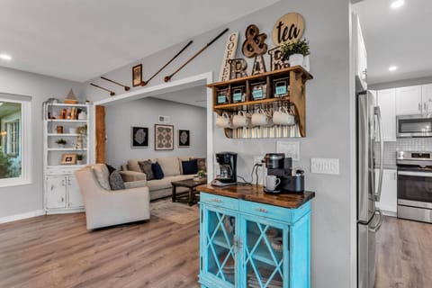 Open living area with coffee bar, built-ins, and inviting seating.