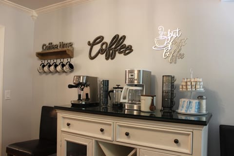 Close up of coffee bar equipped with Breville espresso/cappuccino machine