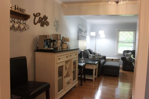 Coffee bar equipped w/Cuisinart 14 Cup coffee machine & assorted coffee flavors