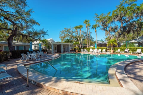 Old style pool with real 8' deep end.  Plenty of chairs to lounge. 