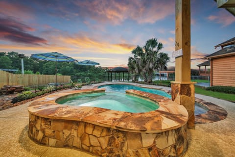 Relax in the spa, enjoy a cold beverage while watching the kids play in the pool