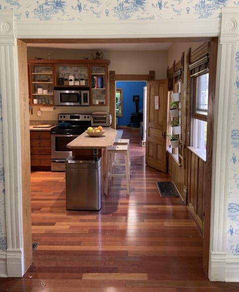 Looking into the kitchen (and further, the living room) from the dining room
