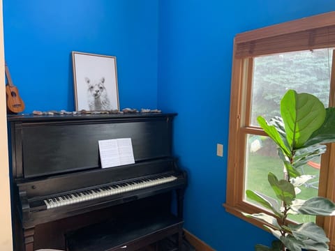 Upright piano, view out to backyard
