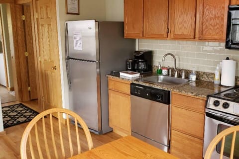 Fully equipped kitchen with cookware provided. Coffee, oil/vinegar, spices included