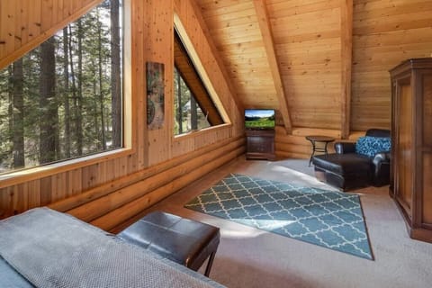 Sitting area of upstairs bedroom to take in the forest views.