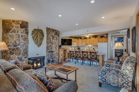Living room with a wood-burning fireplace