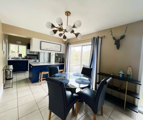 Dining area and Kitchen with access to deck and views of Perch L - Dining area and Kitchen with access to deck and views of Perch Lake.