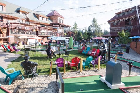 Gather outdoors with games, lights, and lively resort energy.
