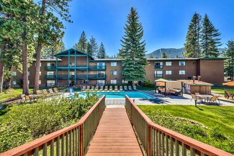 Dive into sunshine beside the resort pool and mountain views