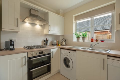 Ground floor: Well-equipped kitchen with gas cooker, fridge-freezer, dishwasher, washer-dryer and Nespresso coffee machine