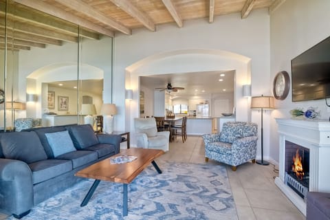 Electric fireplace provides ambiance in the open concept interior