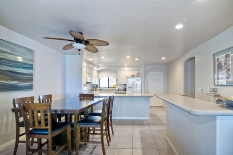 Open concept dining area, kitchen, and coffee bar