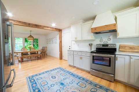 Open concept between kitchen, dining room, and living room.