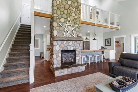 Living Room looking towards the Kitchen and 2nd story catwalk.