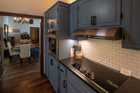 5 Burner cooktop, vented fan and GE Monogram oven.  