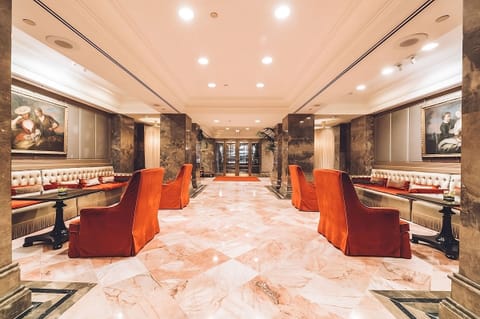 Step into a grand marble lobby glowing with elegance.