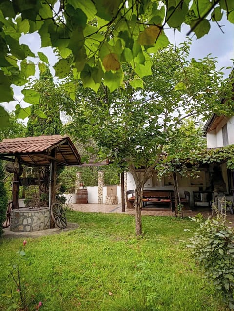 Outside lawn and a dining area that sits eight