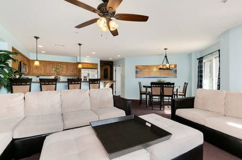 Living room, ceiling fan, TV, spacious sofas