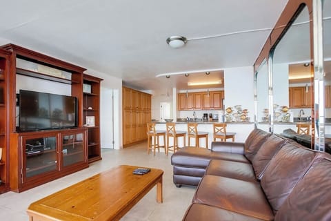 Fully equipped kitchen, breakfast bar, and comfy living room for kicking back after a sun-filled day