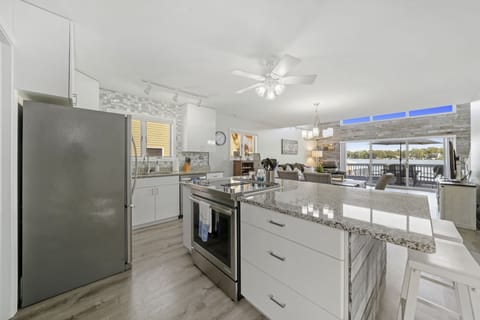 Open kitchen and dining area that's perfect for entertaining! Lake views