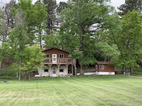 Beautiful setting at the base of a hill, nestled in 110+ year old trees!