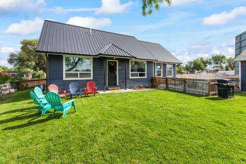 View of the yard and entrance to the home. 