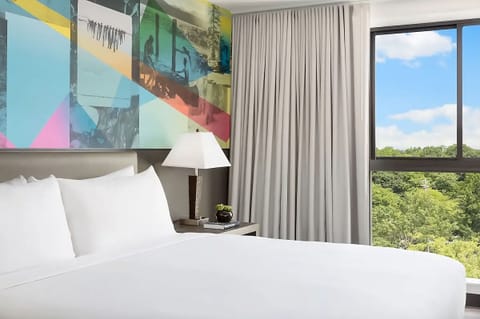 Drift off in plush bedding with calming daylight pouring in.