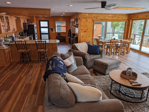 Living room looking back at the kitchen and entry way