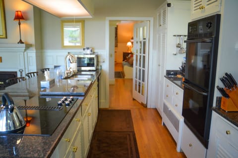 Kitchen w microwave, dishwasher, double oven, stove, and refrigerator.