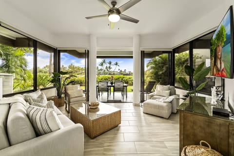 Living Room with Sofas, Smart TV, and Ceiling Fan