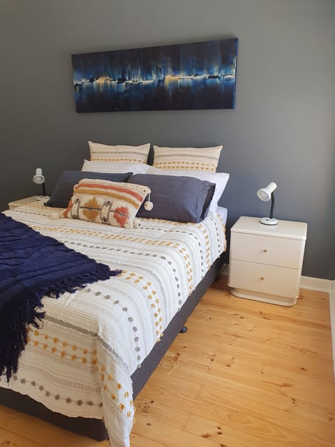 Stylish main bedroom with Queen bed