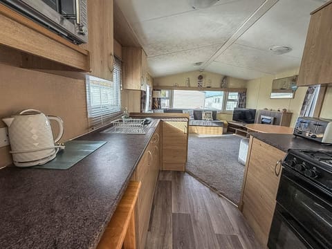 Spacious kitchen with modern appliances and natural light