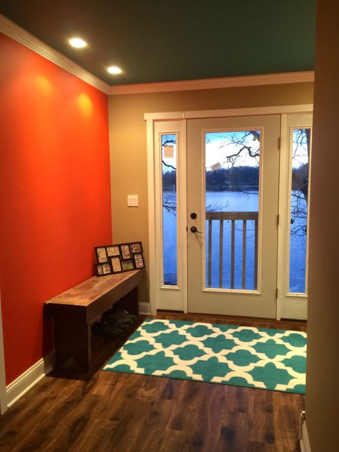 The foyer exits onto the upper level deck.